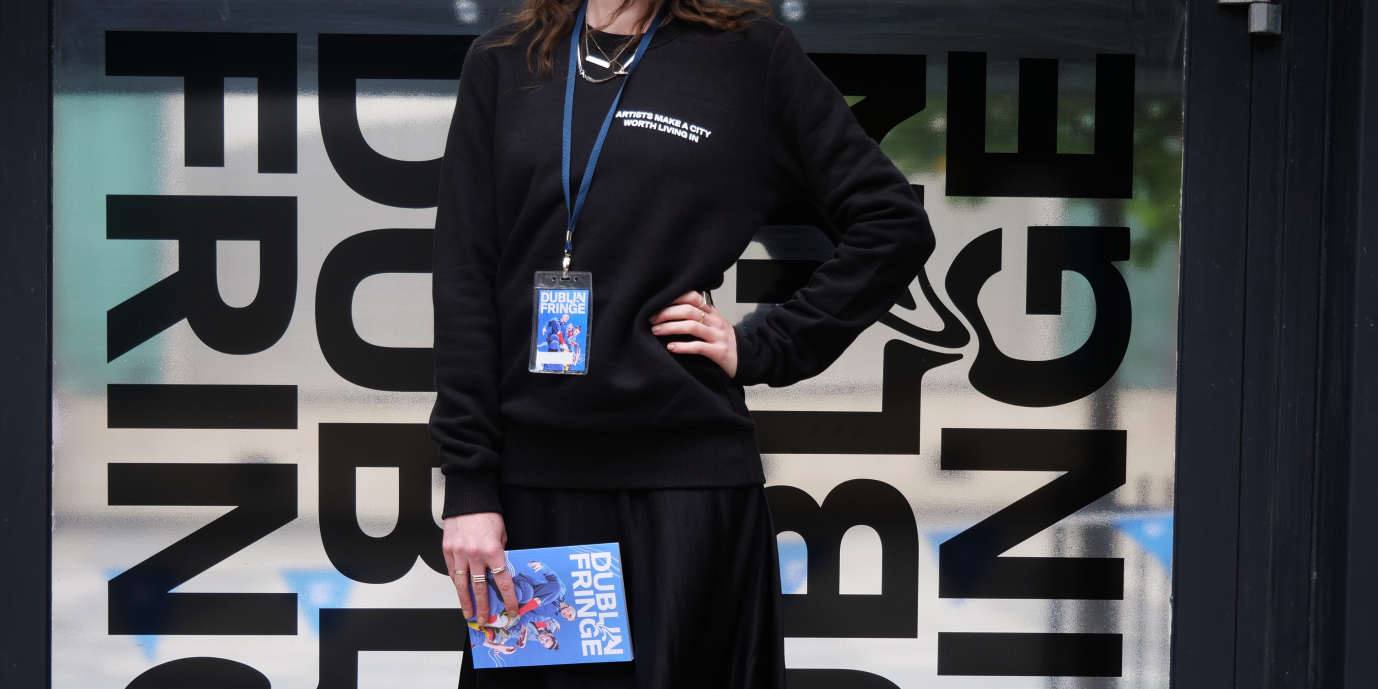 Black Dublin Fringe Sweatshirt modelling in front of Dublin Fringe graphic vinyl