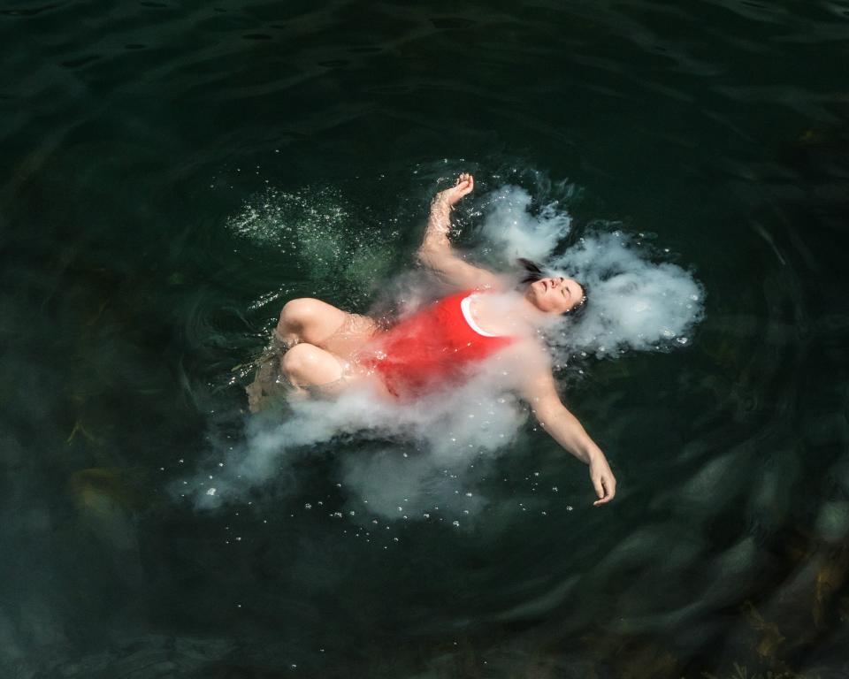 Woman floating in water