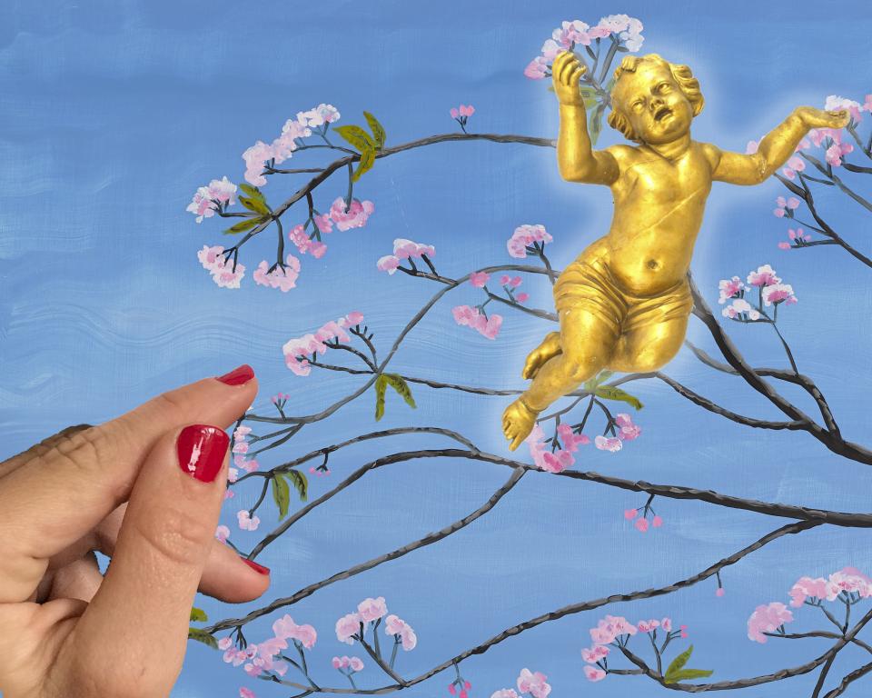 A golden cupid floats against a painting of cherry blossom branches against a blue sky, with a hand with red painted nails rests against the left of the image