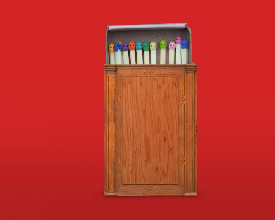 A wooden matchbox, reminiscent of a judge's bench, filled with multicoloured matches lies against a red background