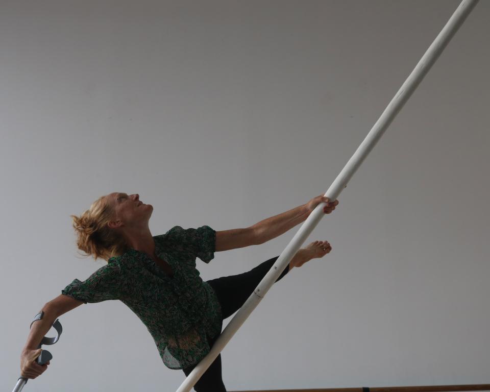 An aerial dancer with a pole