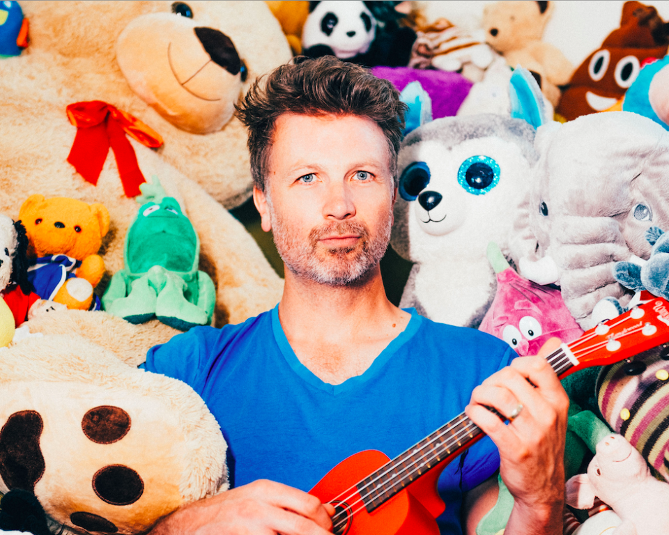 Paul Noonan Surrounded by Teddy Bears