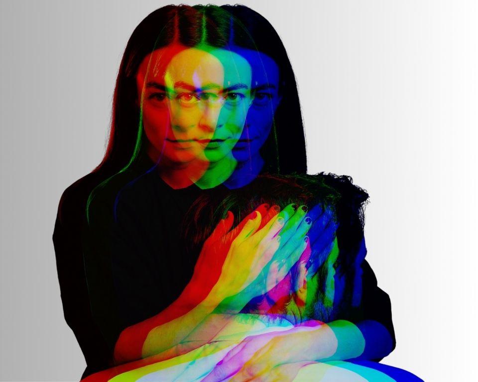 A creative double exposure image featuring a woman holding man.