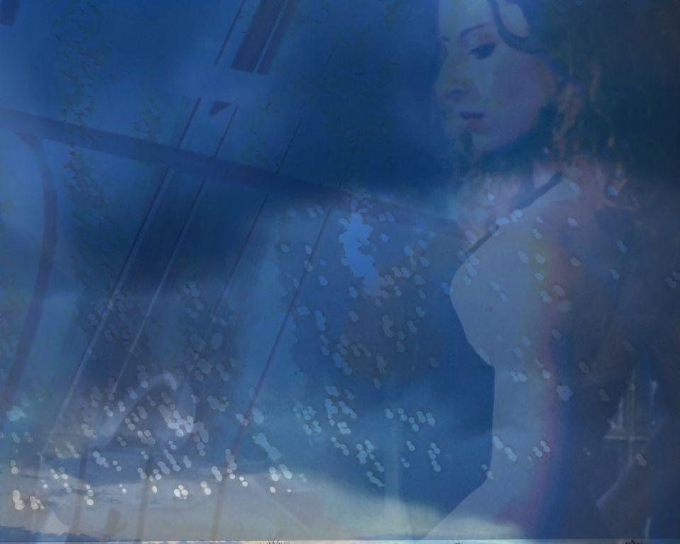 a female figure blured with the imge of sky.