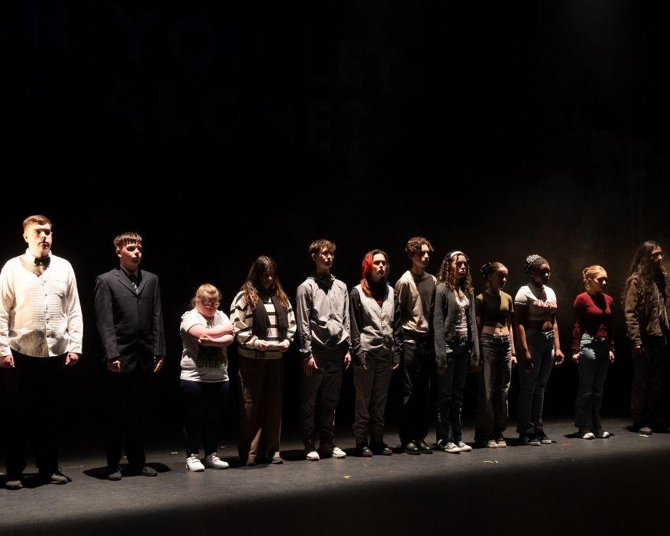 A diverse group of people on stage