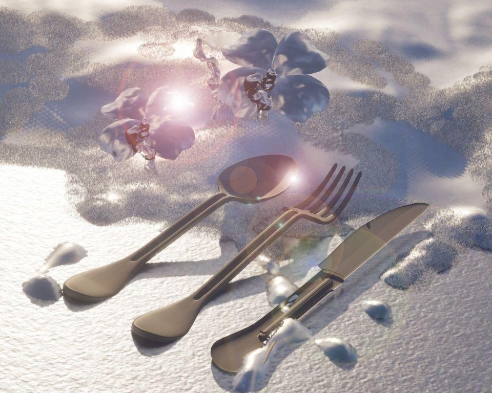 A spoon, fork, and knife rest on a textured white surface with a shadow and glare; two metallic flowers and bright light are in the background.