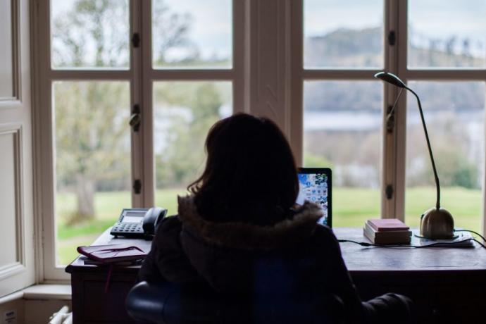 Person sitting at a desk 