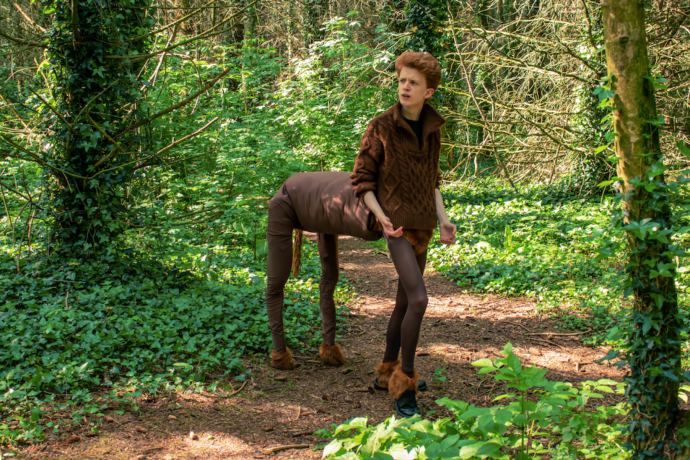 A person dressed as a centaur in the woods 