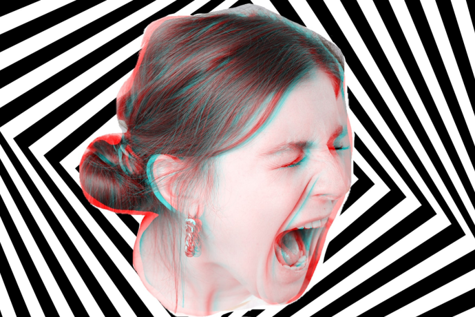 A woman screams against a black and white op art type background 