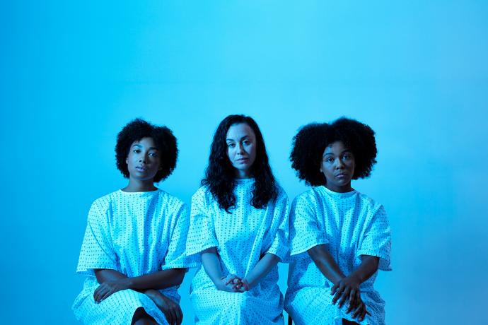 Image of 3 woman in hospital gowns 