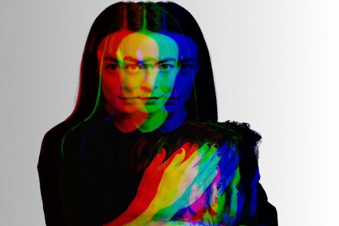 A creative double exposure image featuring a woman holding man.