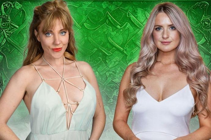 Two women posing for a picture, both smiling and wearing stylish dresses. They stand against a green backdrop,showcasing their outfits and accessories.