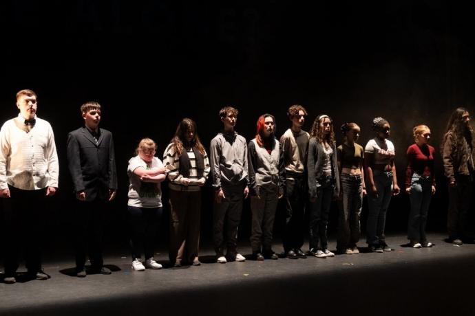 A diverse group of people on stage