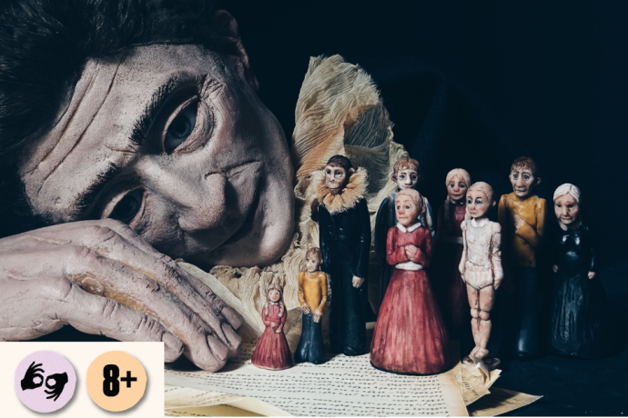 A large puppet-like figure rests its head beside a row of small hand-crafted dolls on a dark stage. Visible symbols: ISL and 8+.