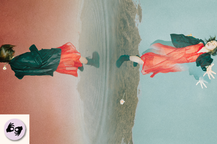 Two performers in red dresses appear mirrored and floating against a misty beach or shoreline landscape. Visible symbol: ISL.