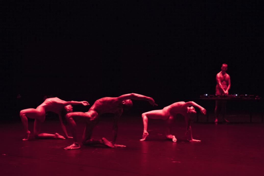 On Spirals, three dancers in red light