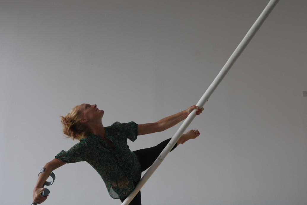 An aerial dancer with a pole