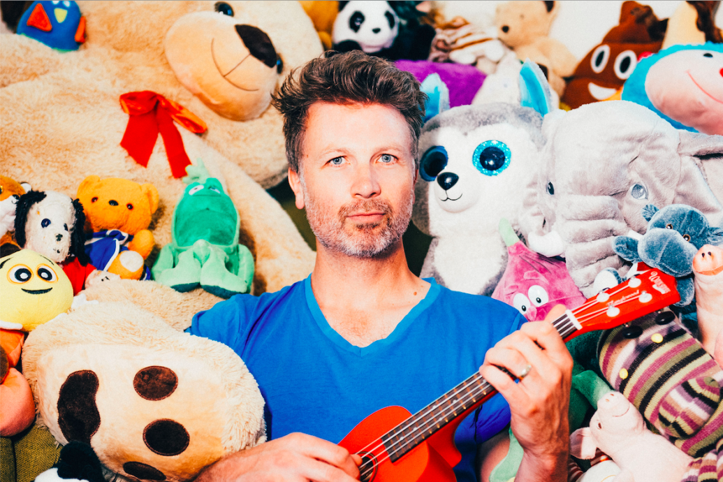 Paul Noonan Surrounded by Teddy Bears
