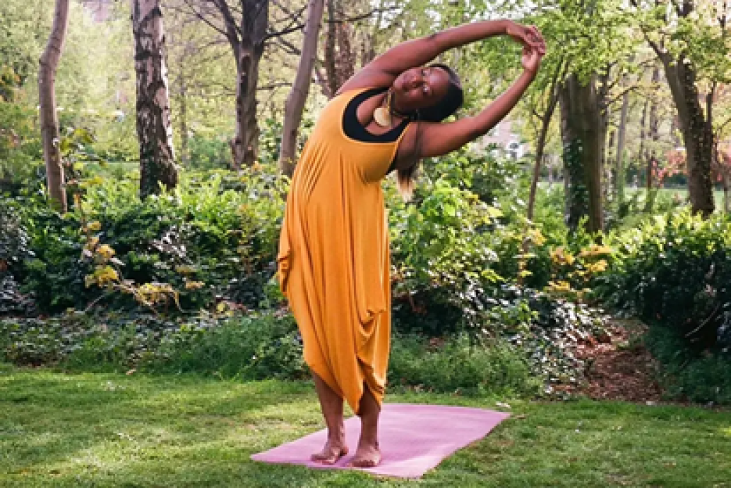 Yoga instructor Reeta Cherie posing outdoors in nature