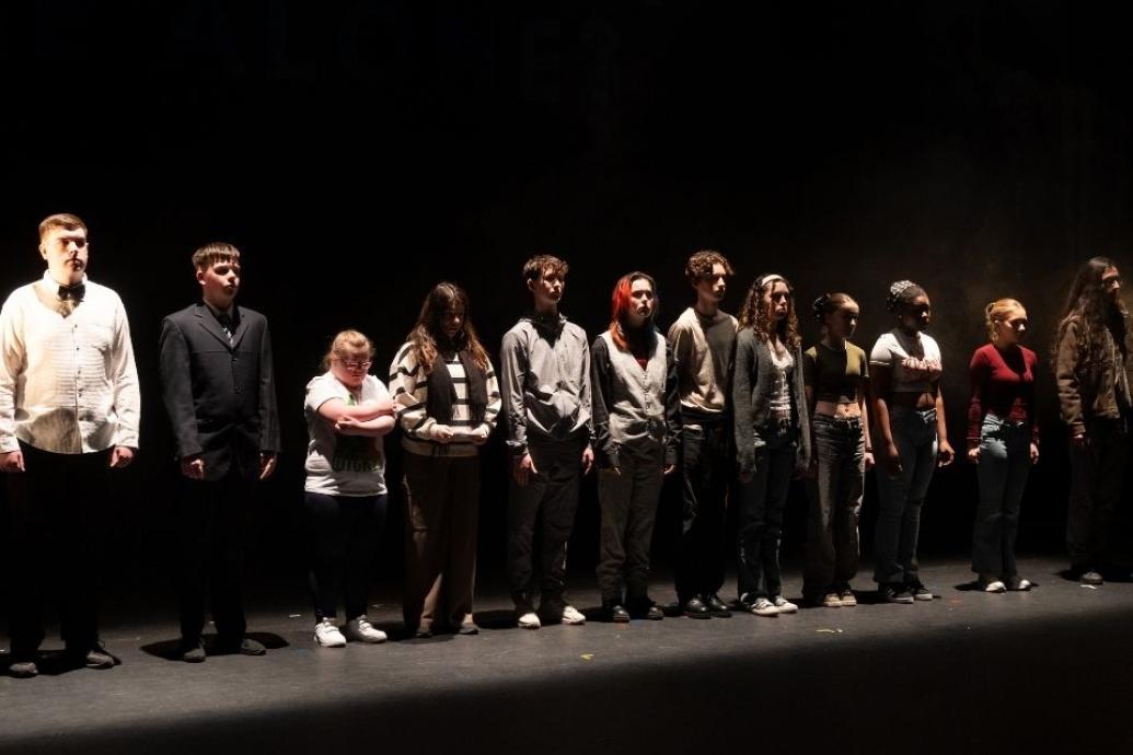 A diverse group of people on stage