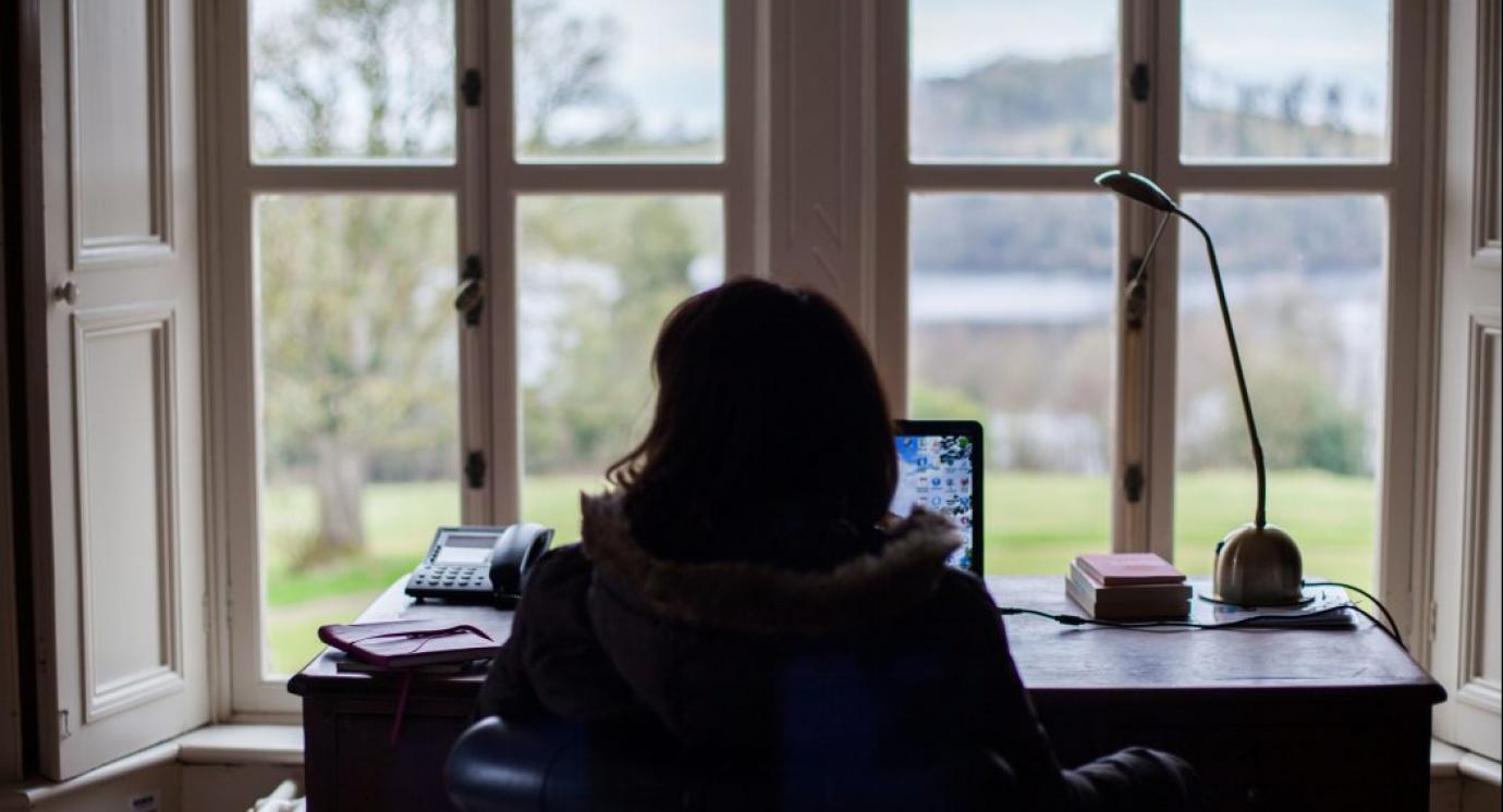 Person sitting at a desk 