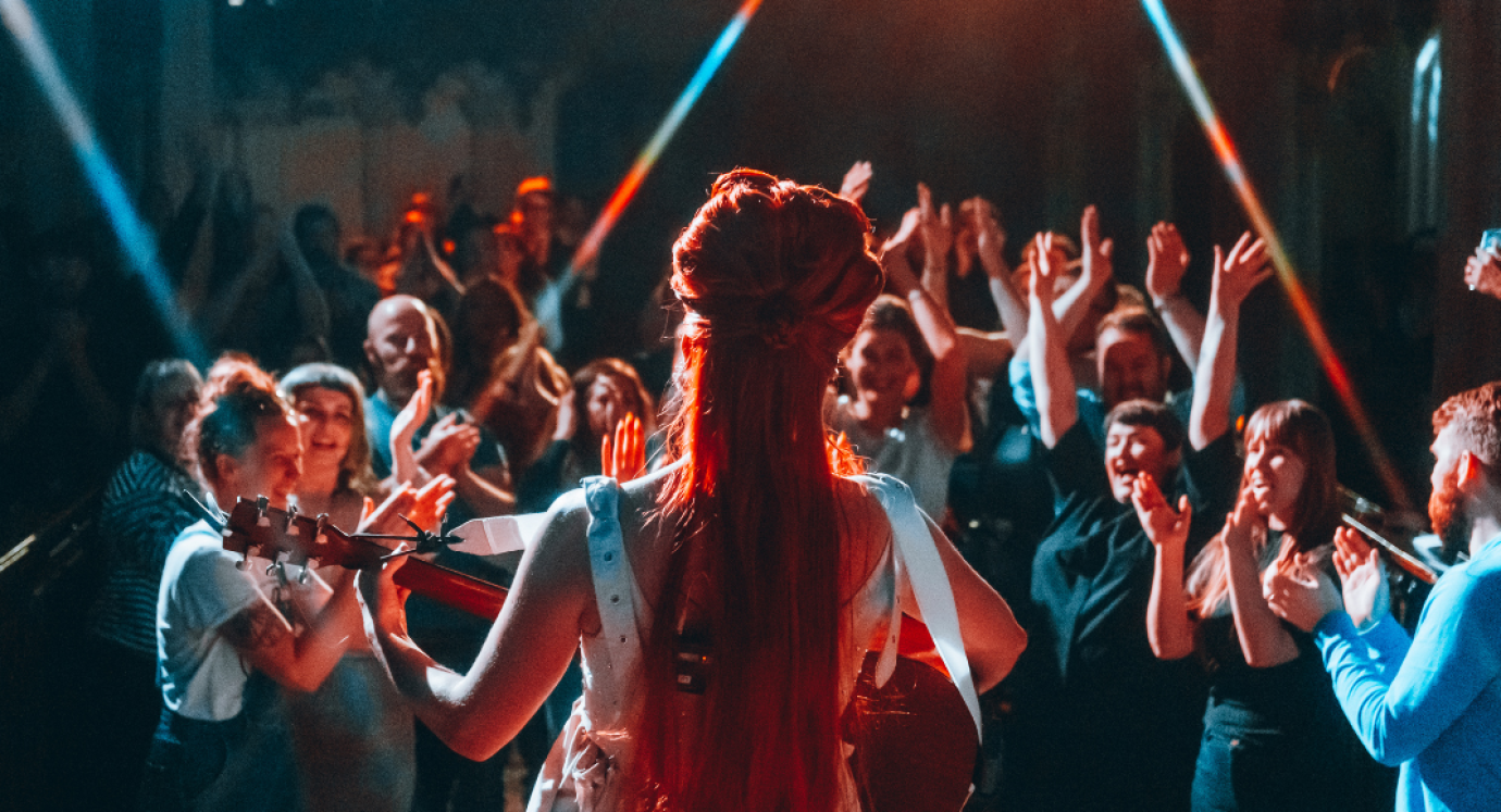 View from behind the artist on stage showing the audience 